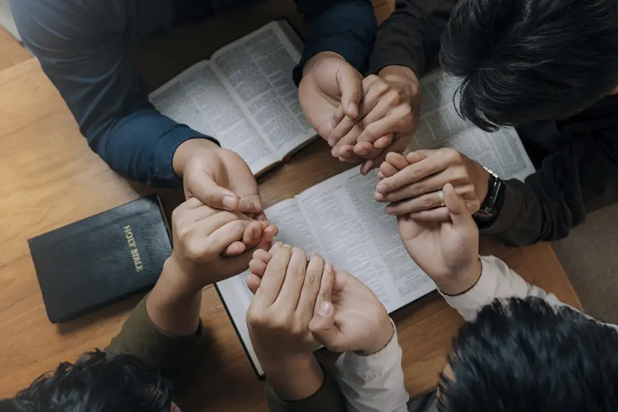 Group of women reading book together bonding